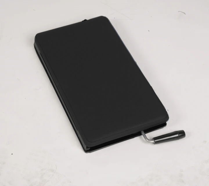 Black polyvinyl Lifetimer International portable Lumbo Pelvic, lumbar and thoracic drop piece for chiropractic adjustment therapy for chiropractors