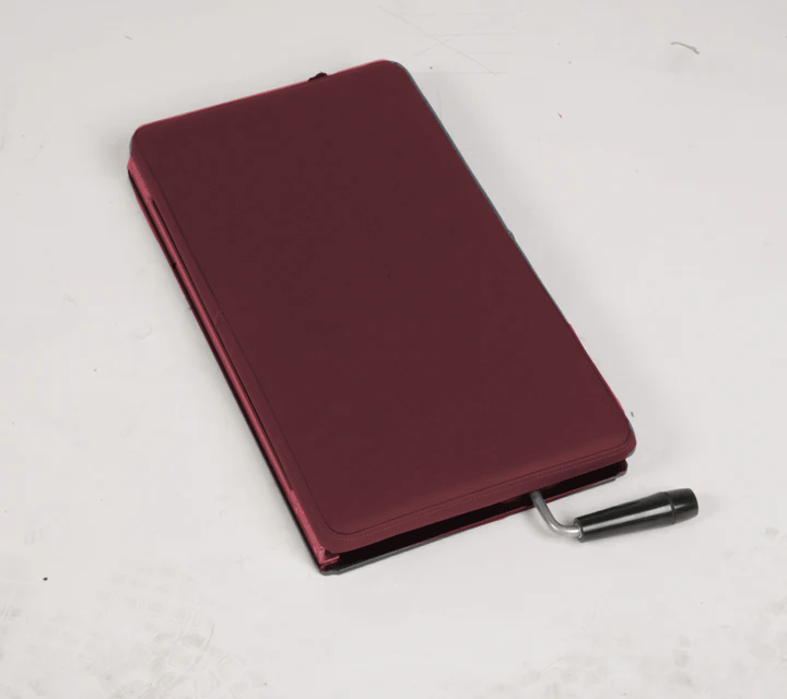 Burgundy polyvinyl Lifetimer International portable Lumbo Pelvic, lumbar and thoracic drop piece for chiropractic adjustment therapy for chiropractors