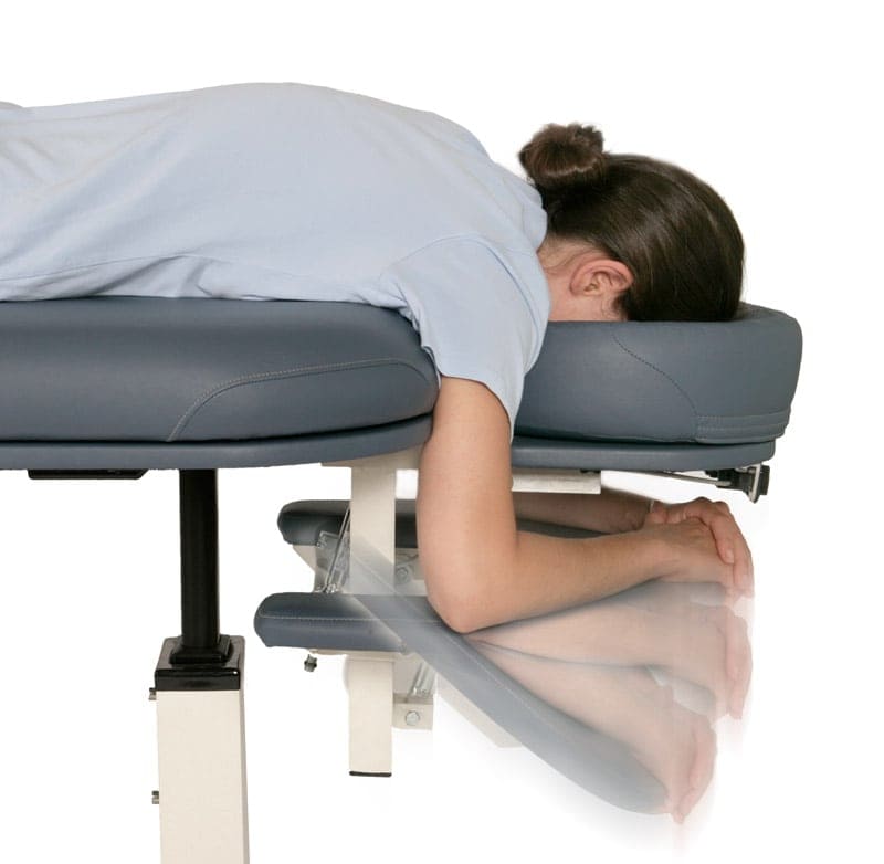 Patient model with blue Lifetimer International Table option accessory ergonomic pivoting arm rests for portable and elevation chiropractic, massage and physical therapy tables