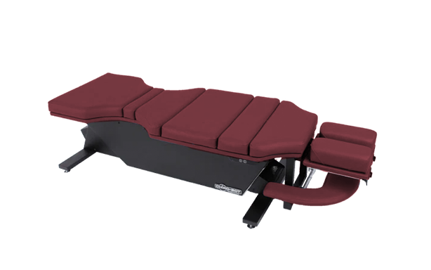 Lifetimer International | burgundy battery-operated chiropractic Lifetimer International CHIRO-BOT ergonomic programmable elevation lift table with foot pedal for chiropractic adjustment drop therapy, massage therapy, acupuncture therapy, physical therapy, naturopathy with rectangular face cushion headpiece